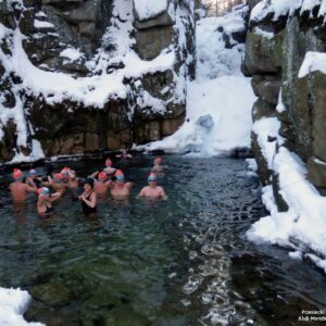 Winter Ice Swimming in a Waterfall